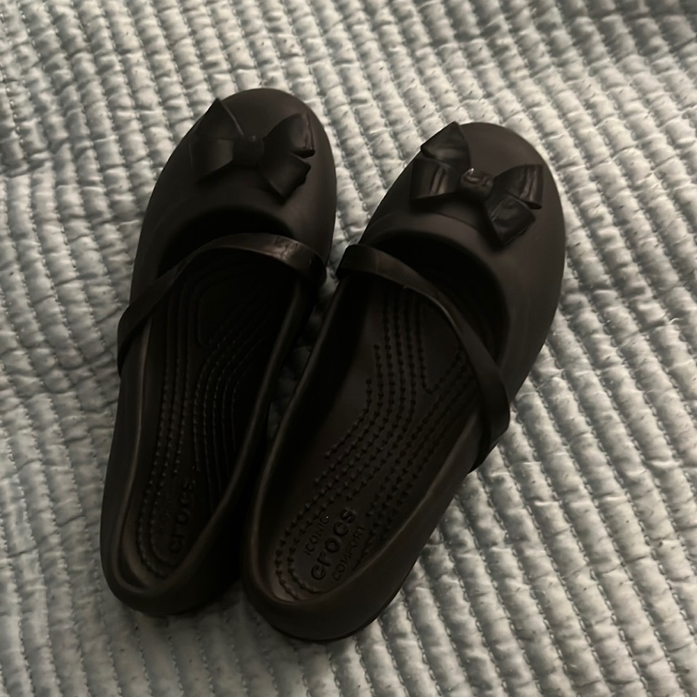 Black crocs with bow